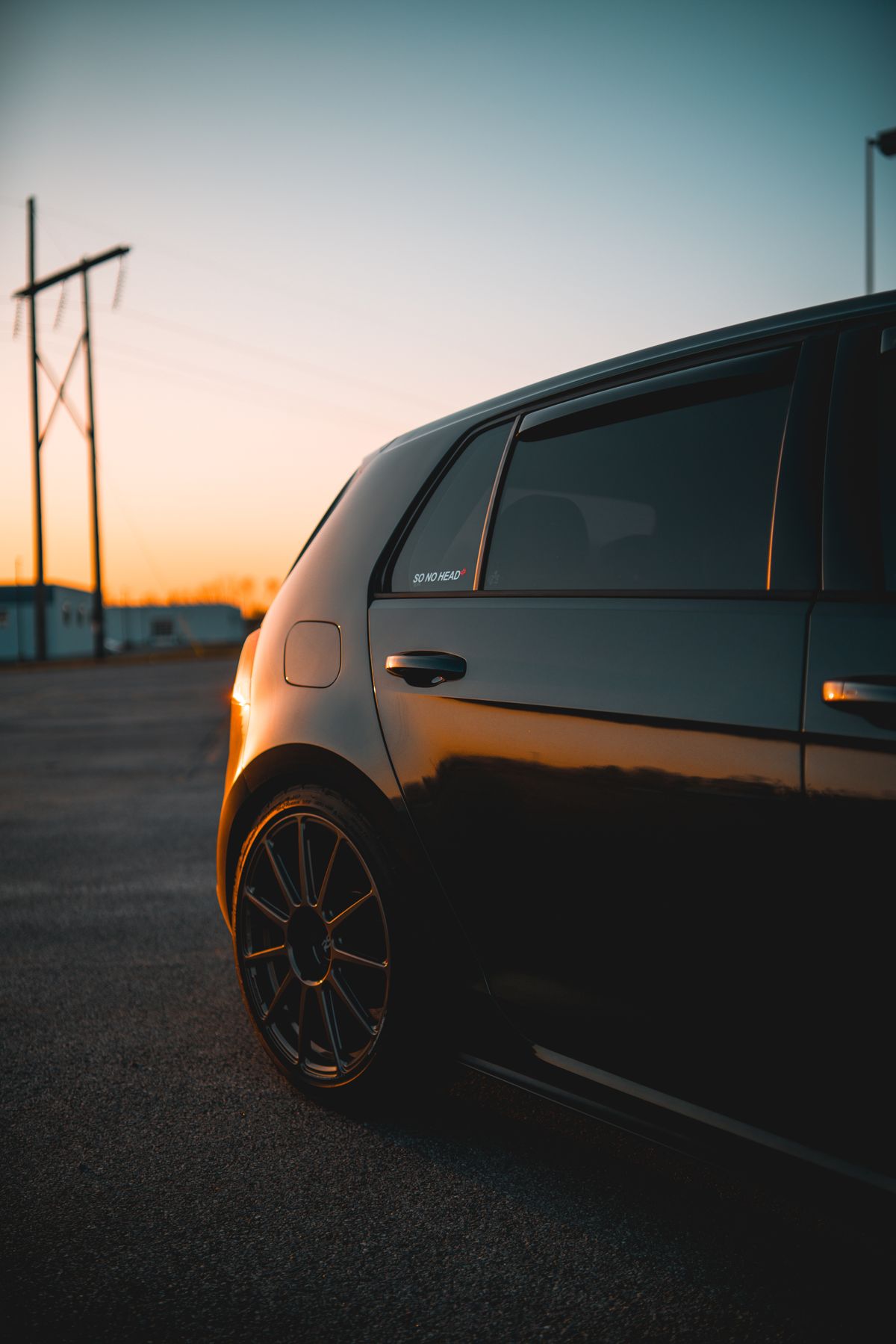 Black car with blacked-out rims