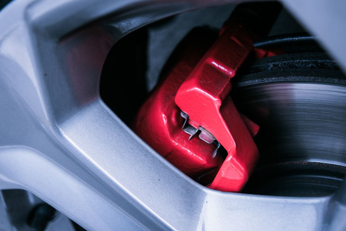 Refurbished red brake caliper and disc