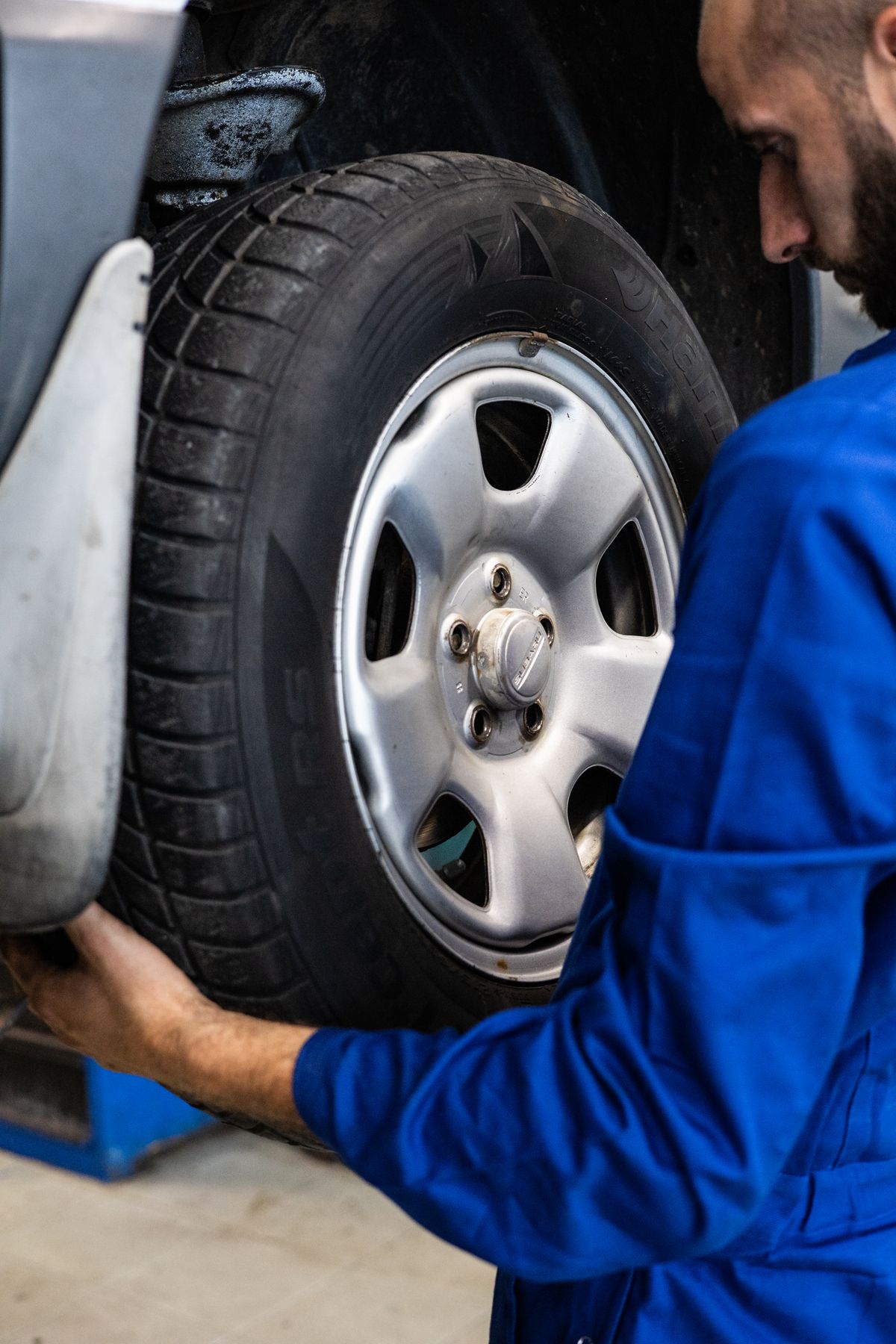 Alloy wheel being inspected for repair