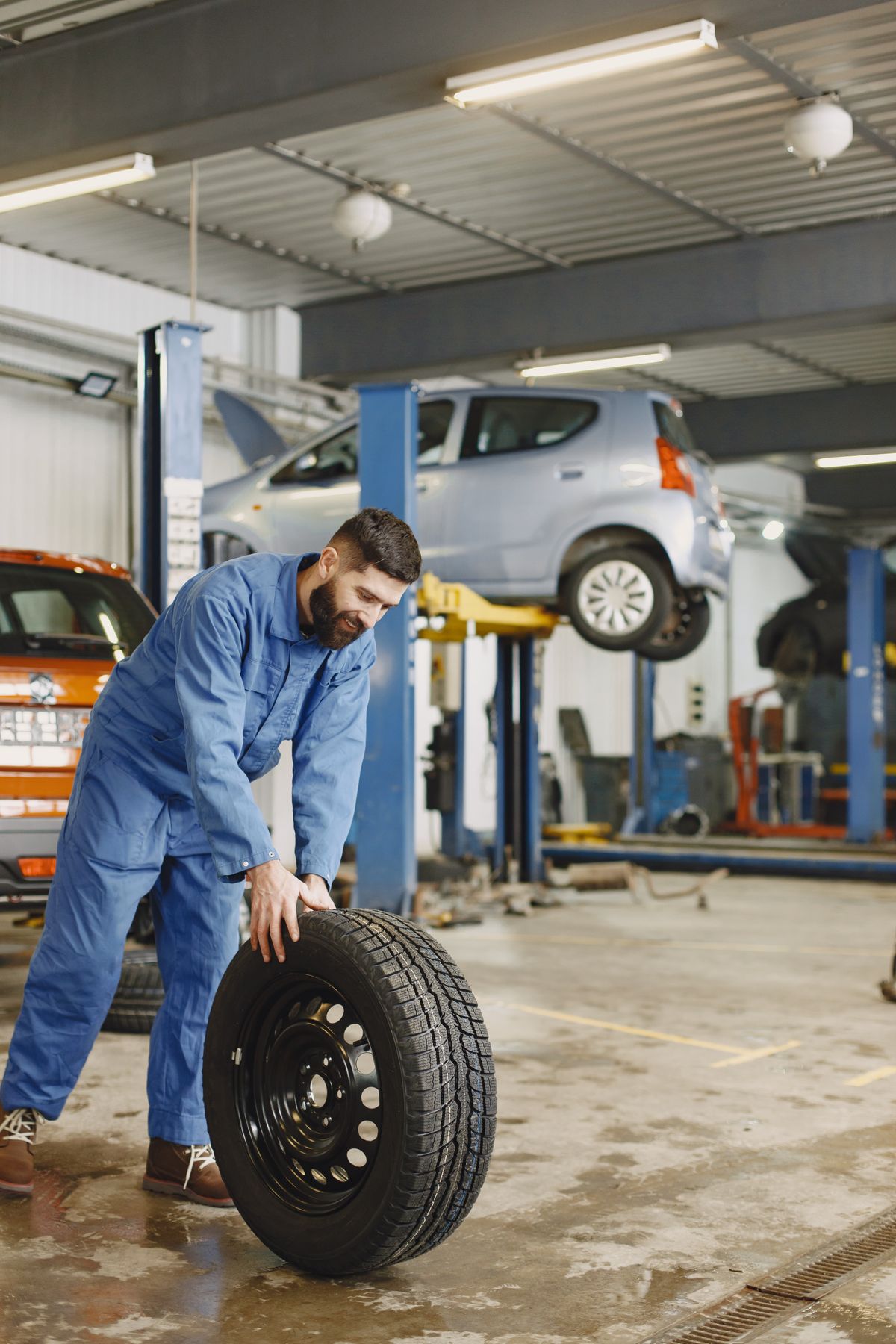 Technician repairing a tyre puncture